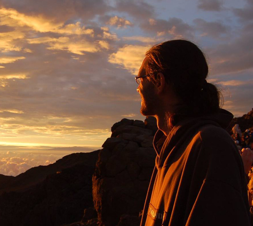 Paul, watching the sun rise over Haleakala, Maui.